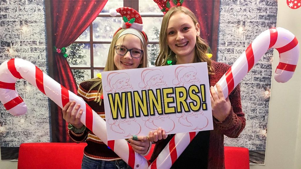 Happy players of Crazy Christmas Heist escape room.