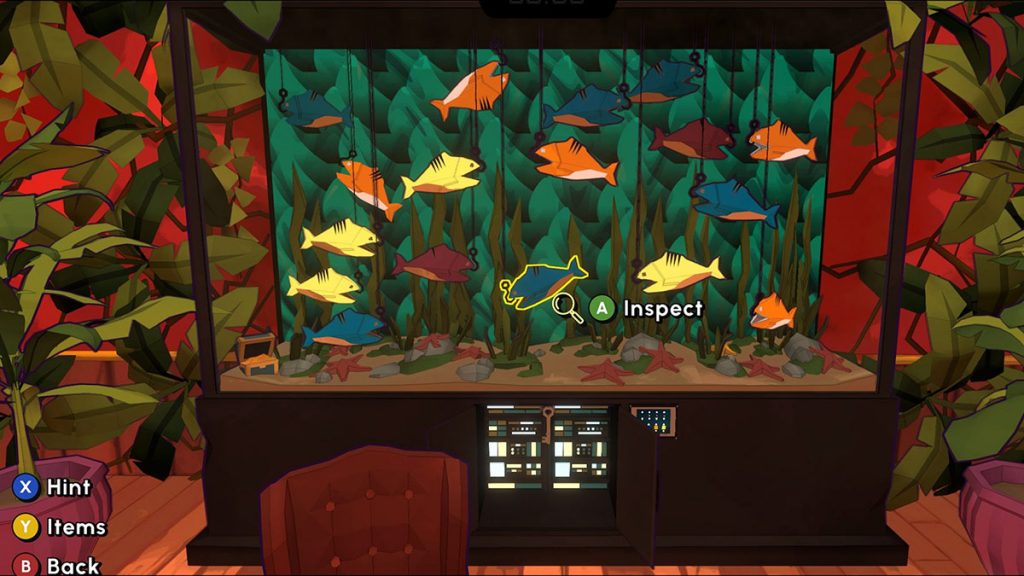 A fish tank filled with colorful artificial fish and video game controls.