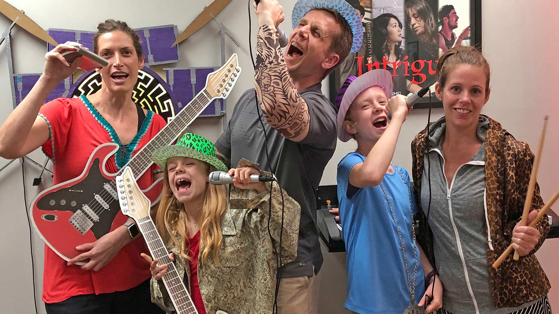 family having fun playing Save The Concert escape room